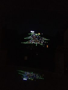 The city of Gubbio, Italy, lit up on its mountain like a giant Christmas tree